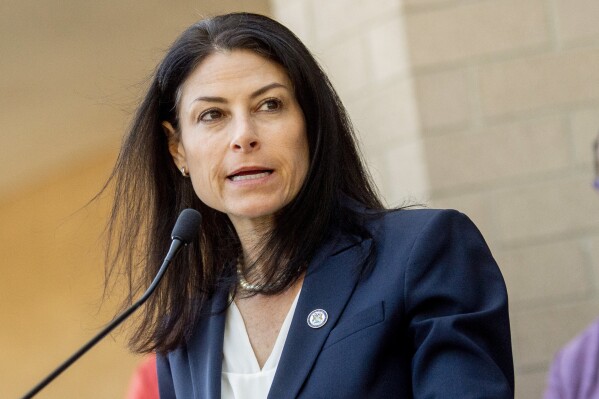 FILE - Michigan Attorney General Dana Nessel speaks during a news conference Sept. 19, 2022, outside of the Genesee County Sheriff's Office in Flint, Mich. Three Chilean nationals have been arrested in connection with a series of burglaries of mansions and other high-end homes in suburban Detroit and across Michigan. The charges were announced Monday, Dec. 11, 2023, by Nessel, who said the three are suspected in eight break-ins after they arrived in the Detroit area on a Feb. 1 flight from Los Angeles. (Jake May/The Flint Journal via AP, File)