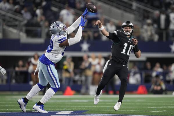 Dallas Cowboys' Chauncey Golston tips a pass thrown by Philadelphia Eagles' Gardner Minshew during the second half of an NFL football game Saturday, Dec. 24, 2022, in Arlington, Texas. (AP Photo/Tony Gutierrez)