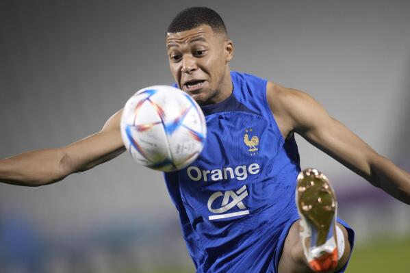 France's Kylian Mbappe controls the ball during a training session at the Jassim Bin Hamad stadium in Doha, Qatar, Friday, Dec. 2, 2022. France will play in the World Cup against Poland on Dec. 4. (AP Photo/Christophe Ena)