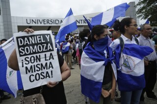 FILE - Demonstrators protest outside the Jesuit-run Universidad Centroamericana, UCA, demanding the university's allocation of its share of 6% of the national budget in Managua, Nicaragua, Aug. 2, 2018. The Jesuits announced Wednesday, Aug. 16, 2023, that Nicaragua's government has confiscated the UCA, one of the region's most highly regarded colleges. (AP Photo/Arnulfo Franco, File)