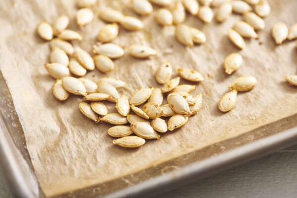 Pumpkin seeds appear on a kitchen counter in New York in 2019. (Cheyenne M. Cohen via AP)