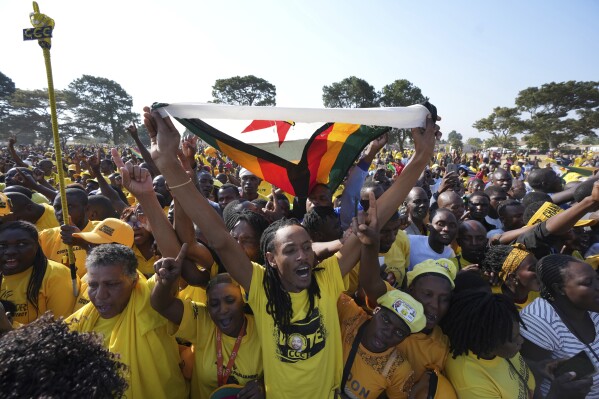 Supporters of Zimbabwe's main opposition leader Nelson Chamisa are seen during a rally on the outskirts of Harare on Sunday, Aug 30, 2023. In an interview with The Associated Press Chamisa gave warning that any evidence of tampering by Mnangagwa's ruling ZANU-PF party in this month's elections could lead to "total disaster" for an already-beleaguered nation. Zimbabwe has a history of violent and disputed votes. (AP Photo/Tsvangirayi Mukwazhi)