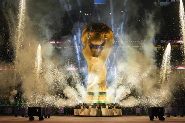 The World Cup trophy replica is shown during the opening ceremony in the World Cup quarterfinal soccer match between Croatia and Brazil, at the Education City Stadium in Al Rayyan, Qatar, Friday, Dec. 9, 2022. (AP Photo/Frank Augstein)