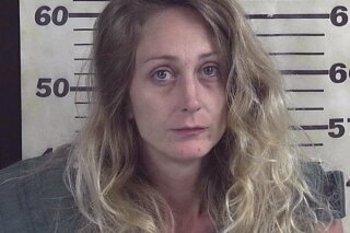 This booking photograph released by the Cullman County Sheriff's Office in Cullman, Ala., shows Erica Cole, who was arrested on charges of shooting her husband in an attempt to shoot someone else in an act of road rage on Saturday, July 6, 2019. (Cullman County Sheriff's Office via AP)