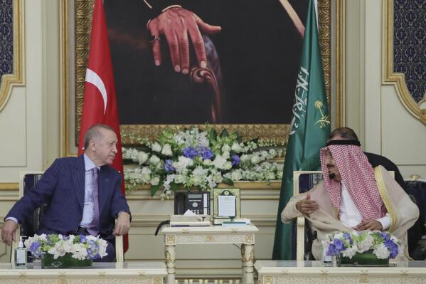 In this photo made available by the Turkish Presidency, Turkish President Recep Tayyip Erdogan, left, and Saudi Arabia's King Salman speak during a meeting in Jiddah, Saudi Arabia, Thursday, April 28, 2022. Erdogan is visiting Saudia in a major reset of relations between two regional heavyweights following the slaying of a Saudi columnist in Istanbul. The Turkish presidency said talks in Saudi Arabia will focus on ways of increasing cooperation and the sides will exchange views on regional and international issues. (Turkish Presidency via AP)
