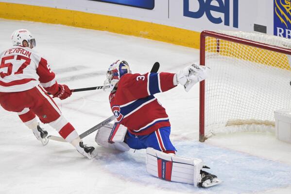 Detroit Red Wings' David Perron scores against Montreal Canadiens goaltender Cayden Primeau during the first period of an NHL hockey game Tuesday, April 4, 2023, in Montreal. (Graham Hughes/The Canadian Press via AP)