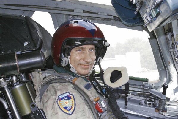 
              FILE In this file photo taken on Tuesday, Aug. 16, 2005, Russian President Vladimir Putin wearing a jump suit sits in the cockpit of a supersonic strategic bomber ready to leave for a training mission, in Moscow, Russia. After 18 years as Russia’s leader _ and with another six-year term sure to follow a March election _ Putin doesn’t show the appetites or vulnerabilities that can personalize Western politics, even when staged or spun. If he has moments of merriment or melancholy, they happen in private. (Sputnik, Kremlin Pool Photo via AP, File)
            