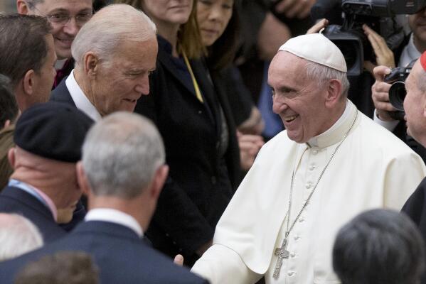 FILE - In this April 29, 2016, file photo Pope Francis shakes hands with Vice President Joe Biden as he takes part in a congress on the progress of regenerative medicine and its cultural impact, being held in the Pope Paul VI hall at the Vatican. The Vatican on Thursday, Oct. 29, 2021 abruptly canceled the planned live broadcast of President Joe Biden’s meeting with Pope Francis, pulling the plug on the eagerly-awaited audience and consolidating the limits on independent information coming out of the Holy See for the past 18 months. The Vatican press office provided no explanation for why the live broadcast of Biden’s visit had been trimmed to just the arrival of his motorcade in the courtyard of the Apostolic Palace.  (AP Photo/Andrew Medichini, File)