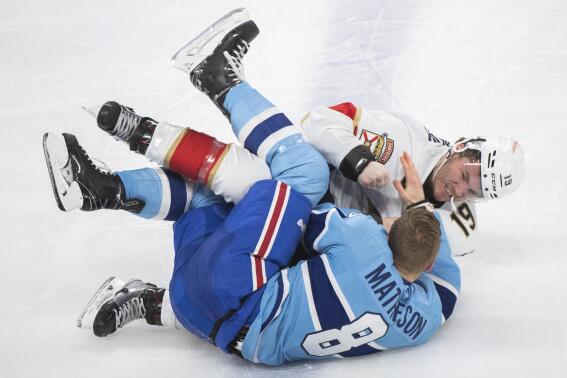 Florida Panthers' Matthew Tkachuk (19) fights with Montreal Canadiens' Mike Matheson during the third period of an NHL hockey game Thursday, Jan. 19, 2023, in Montreal. (Graham Hughes/The Canadian Press via AP)