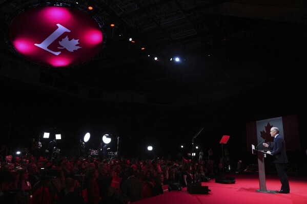 Canadian Prime Minister Mark Carney addresses supporters at his campaign headquarters after the Liberal Party won the Canadian election in Ottawa, Ontario, Tuesday, April 29, 2025. (Sean Kilpatrick/The Canadian Press via AP)