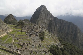 FILE - The Machu Picchu archeological site is devoid of tourists while it's closed amid the COVID-19 pandemic, in the department of Cusco, Peru, Oct. 27, 2020. Cusco, the town closest to the Inca citadel of Machu Picchu, is nearly empty of tourists on Jan. 31, 2024 as workers protest the government's outsourcing ticket sales to one large private company, saying it could hurt small tourism companies that offer lodging, food and logistics. (AP Photo/Martin Mejia, File)