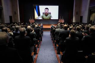 Ukrainian President Volodymyr Zelenskyy delivers a virtual address to Congress by video at the Capitol in Washington, Wednesday, March 16, 2022.   (Drew Angerer, Pool via AP)