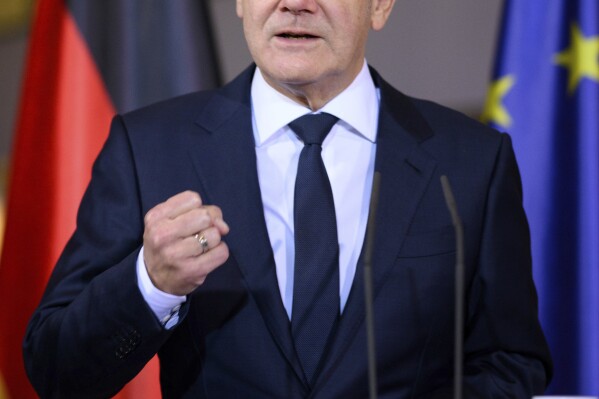 Federal Chancellor Olaf Scholz speaks at a press conference after the federal-state summit at the Federal Chancellery, in Berlin, Tuesday night, Nov. 7, 2023. New, stricter measures to curb the high number of migrants coming to Germany were agreed by Chancellor Olaf Scholz and the 16 state governors in the early hours of Tuesday, reaching a compromise on an issue that has become a huge political problem for the government and a hot-button topic in society. (Bernd von Jutrczenka/dpa via AP)