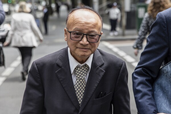 Former Liberal Party candidate Di Sanh Duong departs from the County Court of Victoria in Melbourne, Australia, Thursday, Nov. 16, 2023. Lawyers for the first person to be charged under Australia's foreign interference laws have told a court on Friday that a hospital donation made through a federal government minister was not a covert attempt to curry favor on behalf of the Chinese Communist Party. (Diego Fedele/AAP Image via AP)