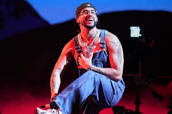 FILE - Bad Bunny performs at the Latin Billboard Awards in Coral Gables, Fla., on Oct. 5, 2023. Bad Bunny's "Monaco" was named one of the top songs of the year by The Associated Press. (AP Photo/Marta Lavandier, File)