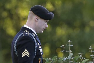 
              Army Sgt. Bowe Bergdahl leaves the Fort Bragg courtroom facility as the judge deliberates during a sentencing hearing at Fort Bragg, N.C., Friday, Nov. 3, 2017.  The judge ruled that Bergdahl to get dishonorable discharge, lose rank, forfeit pay in addition to getting no prison time. Bergdahl, walked off his base in Afghanistan in 2009 and was held by the Taliban for five years, pleaded guilty to desertion and misbehavior before the enemy. (AP Photo/Gerry Broome)
            