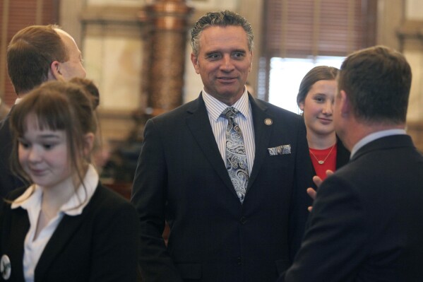 Kansas Senate President Ty Masterson, R-Andover, speaks to fellow senators before the Senate's session, Wednesday, Feb. 7, 2024, at the Statehouse in Topeka, Kan. Masterson says some of the opposition to a pay raise for lawmakers taking effect next year is political grandstanding. (AP Photo/John Hanna)