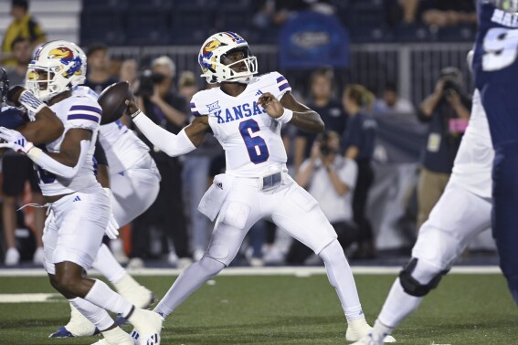 Kansas quarterback Jalon Daniels throw a pass against Nevada during the first half of an NCAA college football game Saturday, Sept. 16, 2023, in Reno Nev. (AP Photo/Andy Barron)