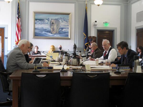 The conference committee of Alaska House and Senate members tasked with negotiating an agreement on a state spending package meet on Tuesday, May 17, 2022, in Juneau, Alaska. The committee reached a tentative agreement that is subject to a vote by the full House and Senate. (AP Photo/Becky Bohrer)
