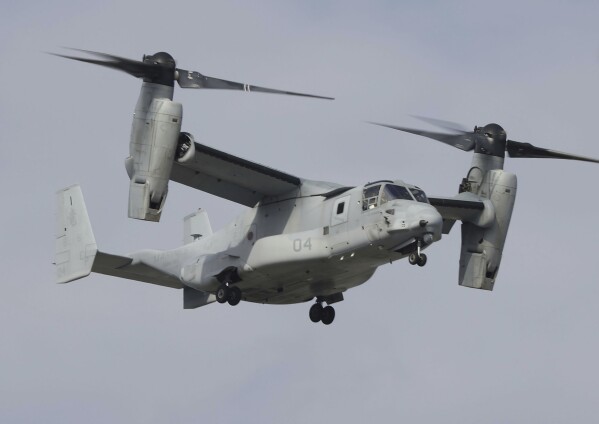 A U.S. MV-22 Osprey aircraft flies around the U.S. Marine Corps Air Station Futenma in Ginowan, Okinawa, southern Japan Thursday, March 14, 2024. The U.S. and Japanese militaries resumed flights of Osprey aircraft in Japan. (Kyodo News via AP)
