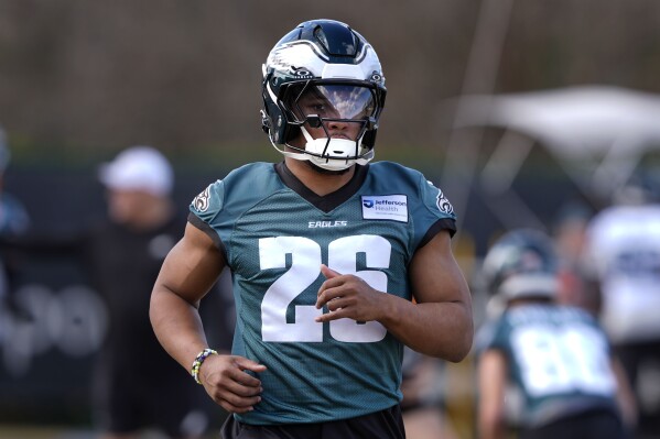Philadelphia Eagles running back Saquon Barkley (26) runs through drills during an NFL football practice Wednesday, Feb. 5, 2025, in New Orleans, ahead of Super Bowl 59 against the Kansas City Chiefs. (AP Photo/Gerald Herbert)