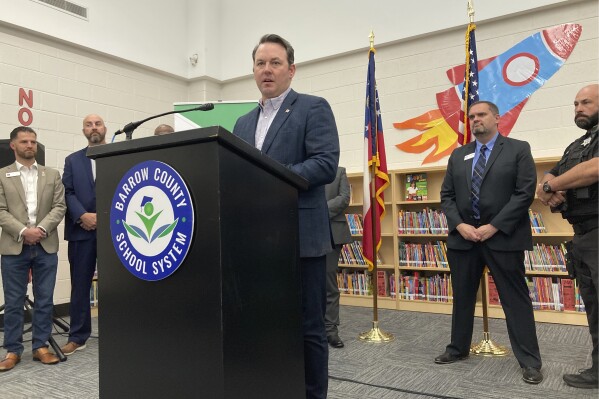 Georgia Lt. Gov. Burt Jones discusses school safety proposals, Wednesday, Oct. 25, 2023, at Austin Road Elementary School in Winder, Ga. Jones says he wants to pay a $10,000 yearly stipend to teachers who pass firearms training, allowing them to carry guns in school. (AP Photo/Jeff Amy)