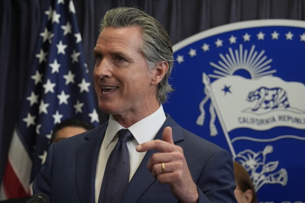 California Gov. Gavin Newsom comments on the passing of Proposition 1, a $6.4 billion bond ballot measure, during a news conference at the Ronald Reagan State Building Thursday, March 21, 2024, in Los Angeles. California voters have passed the measure that will impose strict requirements on counties to spend on housing and drug treatment programs to tackle the state's homelessness crisis. (AP Photo/Damian Dovarganes)