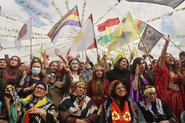 Syrian Kurdish women, most of them wearing traditional clothing, gather to celebrate their Nowruz, Kurdish New Year, in Qamishli, northeastern Syria, Friday March 21, 2025. (AP Photo/Baderkhan Ahmad)