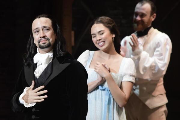 FILE - Lin-Manuel Miranda, creator of the award-winning Broadway musical "Hamilton" receives a standing ovation at the ending of the play's premiere held at the Santurce Fine Arts Center, in San Juan, Puerto Rico, Friday, Jan. 11, 2019. “Hamilton” creator Lin-Manuel Miranda will bring his award-winning musical back to Puerto Rico for two weeks of performances in June, including a fundraiser for the Hispanic Federation and education nonprofit, the Flamboyan Foundation. (AP Photo/Carlos Giusti, File)
