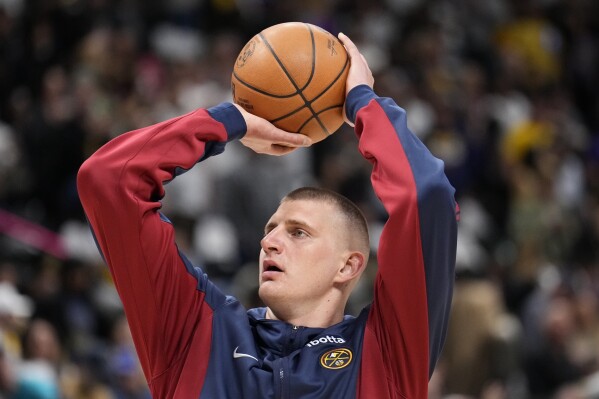 Denver Nuggets center Nikola Jokic warms up prior to Game 1 of an NBA basketball first-round play off game against the Los Angeles Lakers, Saturday, April 20, 2024, in Denver. (AP Photo/Jack Dempsey)