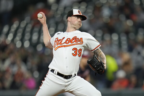 Baltimore Orioles starting pitcher Kyle Bradish throws to the Washington Nationals during the second inning of a baseball game, Tuesday, Sept. 26, 2023, in Baltimore. (AP Photo/Julio Cortez)