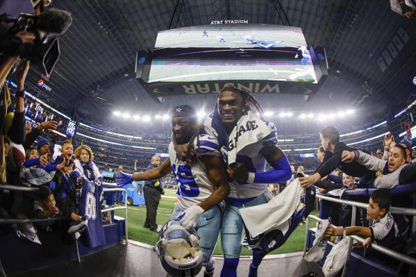Dallas Cowboys' T.Y. Hilton and CeeDee Lamb celebrate after an NFL football game against the Philadelphia Eagles Saturday, Dec. 24, 2022, in Arlington, Texas. The Cowboys won 40-34. (AP Photo/Ron Jenkins)