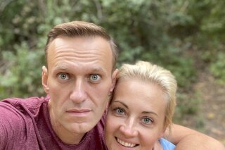 In this photo published by Russian opposition leader Alexei Navalny on his instagram account on Friday, Sept. 25, 2020, Russian opposition leader Alexei Navalny and his wife Yulia pose for a selfie in an unknown location in Germany. This week Navalny was discharged from a Berlin hospital after being treated for what German authorities determined to be nerve agent poisoning. In an Instagram post on Friday, the politician thanked Russian pilots for landing the plane after he collapsed into a coma on Aug. 20 and medics at the Omsk airport injecting him with atropine, saying they gave him "additional 15-20 hours of life." (Navalny Instagram via AP)