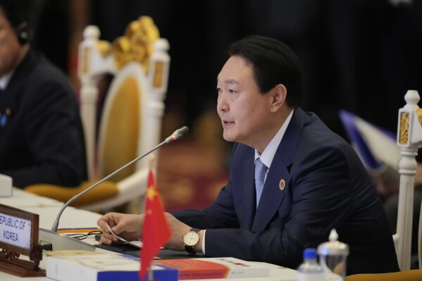 FILE - South Korea's President Yoon Suk Yeol speaks during the ASEAN Plus Three Summits (Association of Southeast Asian Nations) in Phnom Penh, Cambodia, on Nov. 12, 2022. Yoon says he’ll tell world leaders about the need to faithfully enforce U.N. sanctions on North Korea and block the country’s illicit activities to fund its weapons programs when they converge in Indonesia and India for annual summits this week. (AP Photo/Vincent Thian, File)