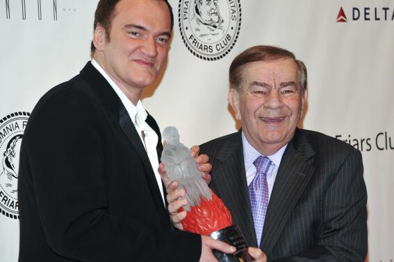 FILE - Director Quentin Tarantino, left, poses with Friars Club Dean Freddie Roman at the Quentin Tarantino Friars Club Roast at the New York Hilton Hotel on Dec. 1, 2010, in New York. Roman, the former dean of The Friars Club and a staple of the Catskills comedy scene, has died at age 85. Roman passed away Saturday afternoon, Nov. 26, 2022, at Bethesda Hospital in Boynton Beach, Fla., his booking agent and friend Alison Chaplin said Sunday. (AP Photo/Evan Agostini, File)