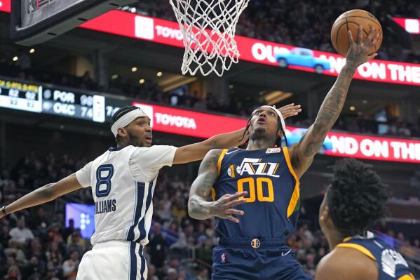 Jazz clinch playoff spot with OT win over Grizzlies