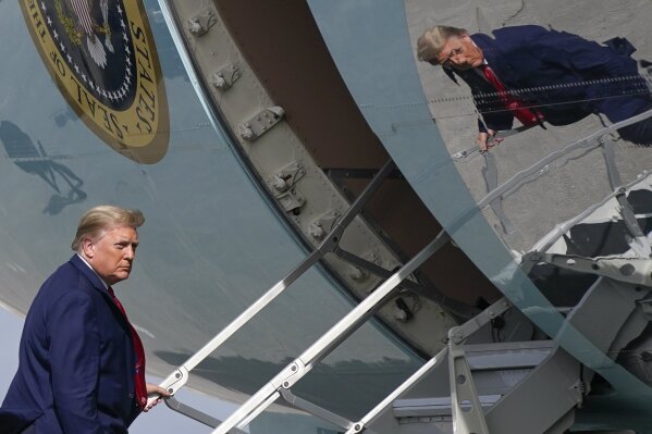 President Donald Trump boards Air Force One at Palm Beach International Airport, Thursday, Dec. 31, 2020, in West Palm Beach, Fla. Trump is returning to Washington after visiting his Mar-a-Lago resort. (AP Photo/Patrick Semansky)