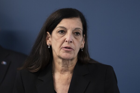 Joanne Pescatore, Chief of Homicide, Philadelphia District Attorney's Office, appears during a news conference in Philadelphia, Tuesday, Dec. 19, 2023. Authorities say a man accused of slashing people with a large knife while riding a bicycle on a rail trail in Philadelphia is now a person of interest in the cold-case murder of a medical student that occurred among a series of high-profile sexual assaults two decades ago. (AP Photo/Matt Rourke)