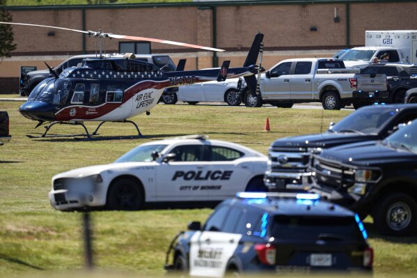 A medical helicopter is seen in front of Apalachee High School after a shooting at the school, Sept. 4, 2024, in Winder, Ga. (AP Photo/Mike Stewart, File)