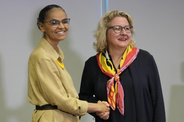 Germany's Economic Cooperation and Development Minister Svenja Schulze, right, shakes hands with Brazil's Environment Minister Marina Silva after giving statements to the press in Brasilia, Brazil, Monday, Jan. 30, 2023. (AP Photo/Eraldo Peres)