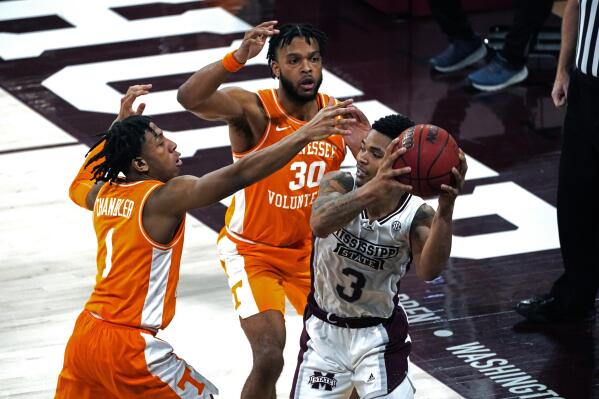 Mississippi State guard Shakeel Moore (3) attempts to pass the ball while Tennessee guards Kennedy Chandler (1) and Josiah-Jordan James (30) defend during the second half of an NCAA college basketball game in Starkville, Miss., Wednesday, Feb. 9, 2022. (AP Photo/Rogelio V. Solis)