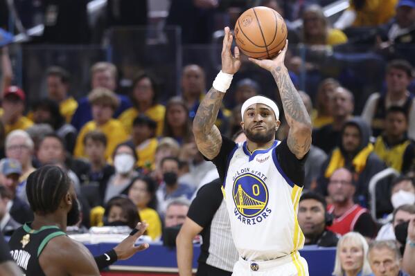 Golden State Warriors guard Gary Payton II (0) shoots against the Boston Celtics during the first half of Game 5 of basketball's NBA Finals in San Francisco, Monday, June 13, 2022. (AP Photo/Jed Jacobsohn)