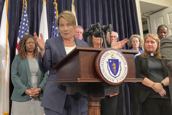 Massachusetts Gov. Maura Healey declares a state of emergency Tuesday, Aug. 8, 2023 in Boston, citing the influx of migrants to the state in need of shelter. Healey said there are nearly 5,600 families or more than 20,000 individuals – many of whom are migrants -- currently living in state shelter across Massachusetts. That's up from around 3,100 families a year ago, about an 80 percent increase. (AP Photo/Steve LeBlanc)