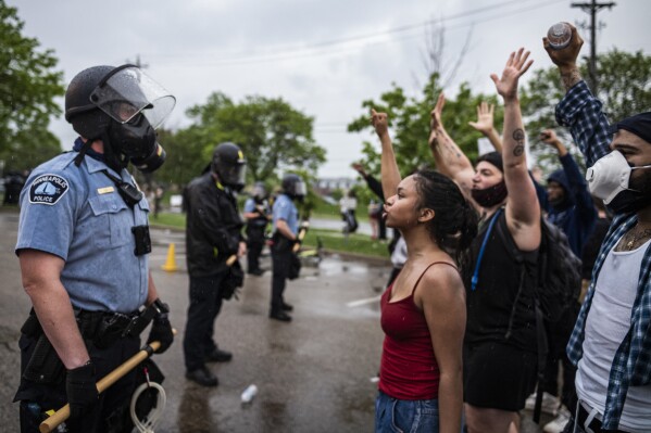 Protesters and police face each other during a rally against the death of George Floyd in Minneapolis on Tuesday, May 26, 2020. (Richard Tsong-Taatarii/Star Tribune via AP, file)