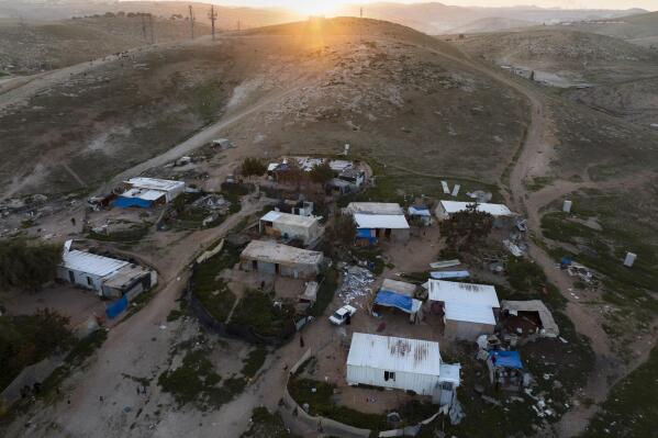 A view of the Bedouin hamlet of Khan al-Ahmar in the West Bank, Sunday, Jan. 22, 2023. The long-running dispute over the West Bank Bedouin community of Khan al-Ahmar, which lost its last legal protection against demolition four years ago, resurfaced this week as a focus of the frozen Israeli-Palestinian conflict. Israel's new far-right ministers vow to evacuate the village as part of a wider project to expand Israeli presence in the 60% of the West Bank over which the military has full control. Palestinians seek that land for a future state. (AP Photo/Oded Balilty)