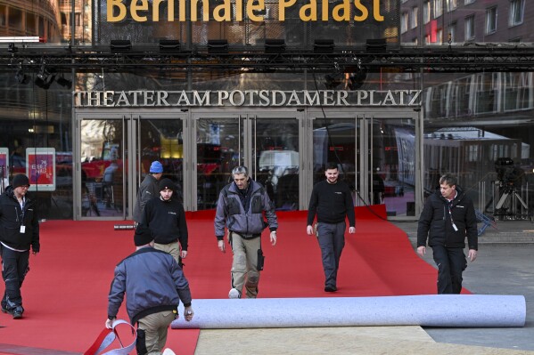 The red carpet is rolled out in front of the Berlinale Palast ahead of the Berlinale Film Festival, in Berlin, Germany, Tuesday Feb. 13 2024. The International Film Festival takes place from February 15 to 25. (Jens Kalaene/dpa via AP)