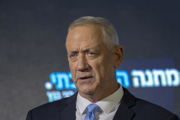 FILE - Benny Gantz speaks at the announcement of former IDF chief Gadi Eisenkot's election bid in Ramat Gan, Israel, on Aug. 14, 2022. Gantz, a centrist member of Israel’s three-member War Cabinet, threatened on Saturday, May 18, 2024, to resign from the government if it doesn't adopt a new plan in three weeks' time for the war in Gaza, a move that would leave Prime Minister Benjamin Netanyahu more reliant on his far-right allies. (AP Photo/Tsafrir Abayov, File)