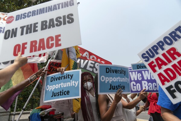 People protest outside of the Supreme Court in Washington, Thursday, June 29, 2023. The Supreme Court on Thursday struck down affirmative action in college admissions, declaring race cannot be a factor and forcing institutions of higher education to look for new ways to achieve diverse student bodies. (AP Photo/Jose Luis Magana)