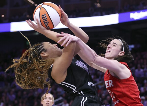 Golden State Valkyries' Veronica Burton is fouled by Indiana Fever's Caitlin Clark in 4th quarter during Valkyries' 88-77 win in WNBA game at Chase Center in San Francisco on Thursday, June 19, 2025. (Scott Strazzante/San Francisco Chronicle via AP)