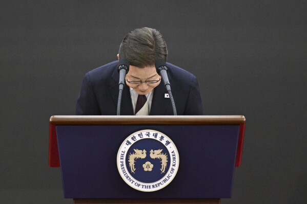 South Korea's President Lee Jae-myung bows as he delivers a speech after taking his oath during his inauguration ceremony at the National Assembly in Seoul on June 4, 2025. (Anthony Wallace/Pool Photo via AP)